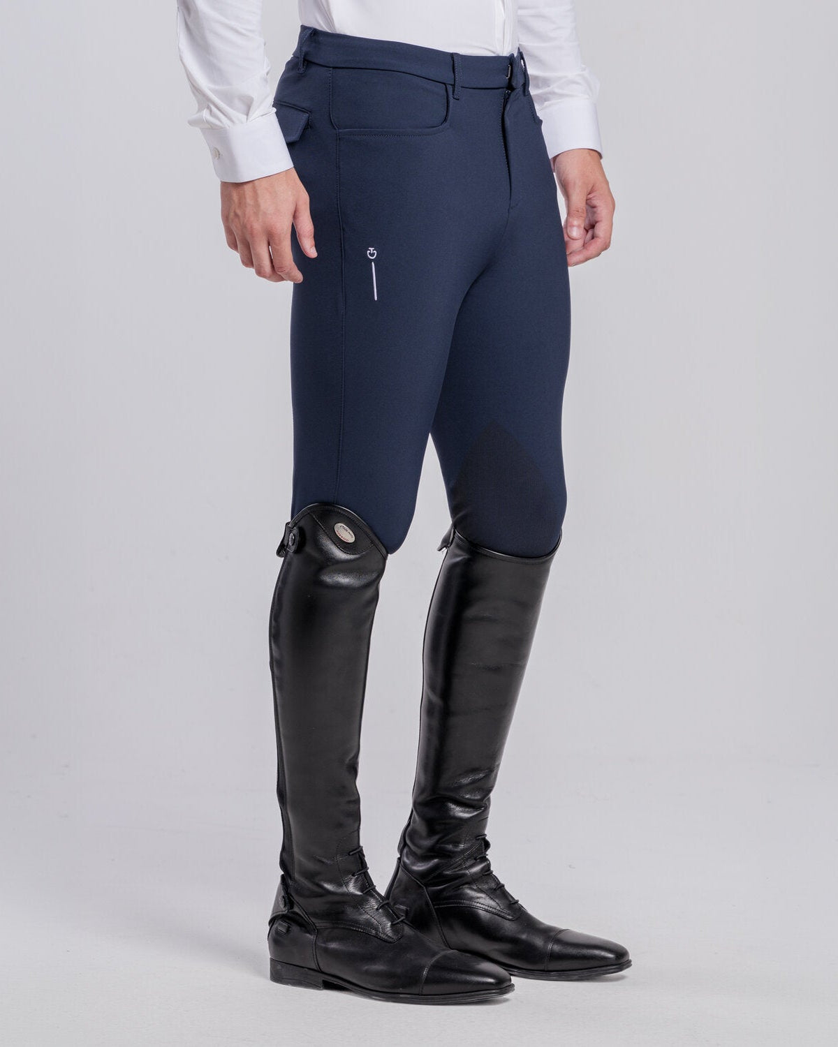 Side view of Cavalleria Toscana CT Mens Revolution Breeches featuring a tailored fit, belt loops, front pockets, zip thigh pocket and contrasting ankle cuffs.