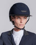 Model wearing the Cavalleria Toscana CT Wide Brim Riding Helmet with signature CT logo, KASK branding and secure chinstrap, styled with equestrian competition clothing.