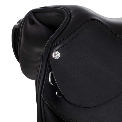 Dressage saddle with removable blocks