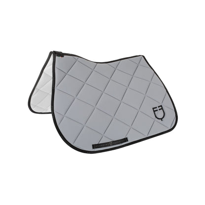 Jumping saddle pad technical fabric with logo.