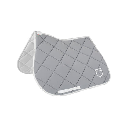 Jumping saddle pad technical fabric with logo.