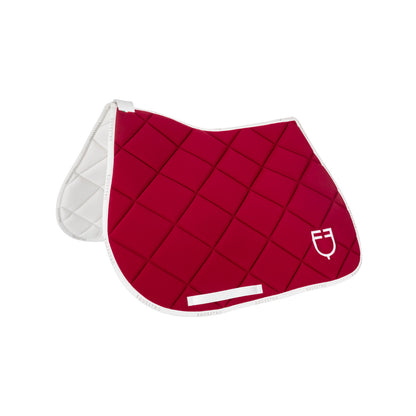 Jumping saddle pad technical fabric with logo.