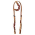 ONE EAR BRIDLE WITH BRAIDED LEATHER DECORATIONS.