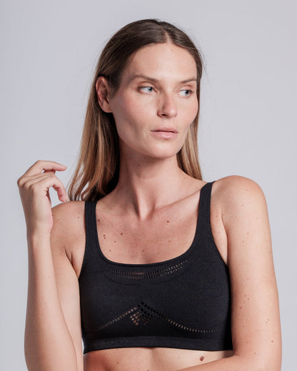 Model wearing the Cavalleria Toscana CT Technical Knit Sports Bra, featuring a seamless design, wide shoulder straps, breathable perforated detailing and signature CT logo.