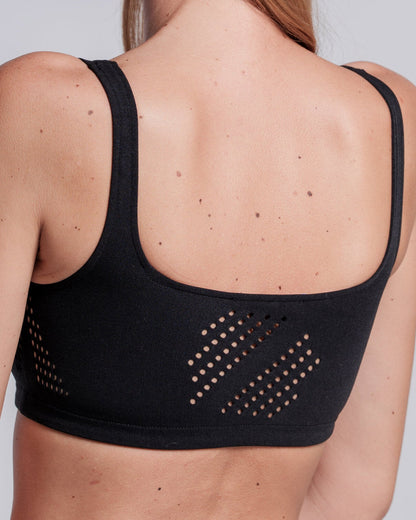 Model wearing the Cavalleria Toscana CT Technical Knit Sports Bra, featuring a seamless design, wide shoulder straps, breathable perforated detailing and signature CT logo.