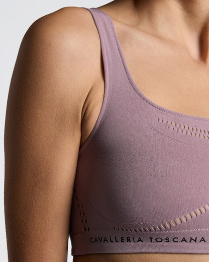 Model wearing the Cavalleria Toscana CT Technical Knit Sports Bra, featuring a seamless design, wide shoulder straps, breathable perforated detailing and signature CT logo.