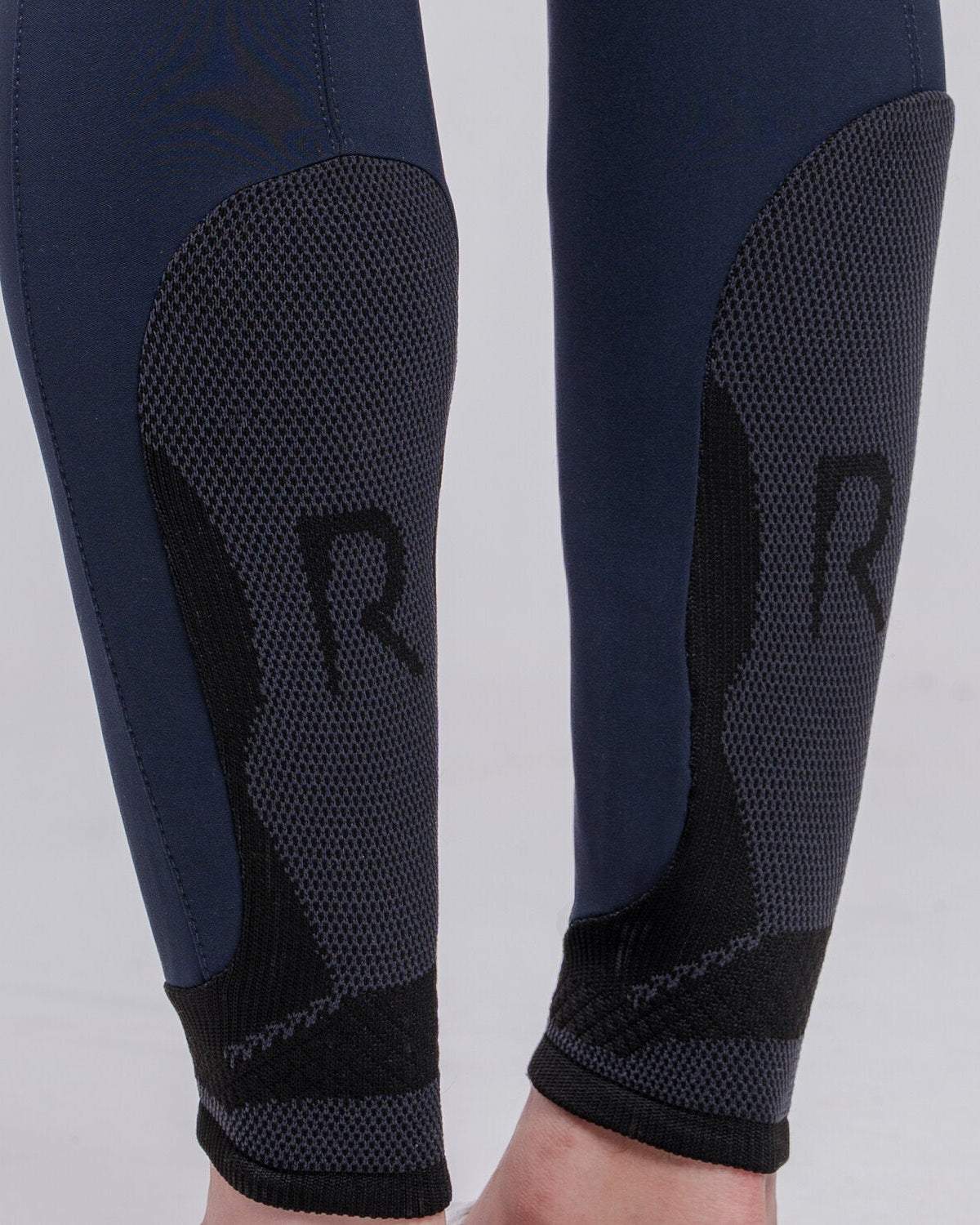 Close up of Cavalleria Toscana CT Mens Revolution Breeches featuring a tailored fit, belt loops, front pockets, zip thigh pocket and contrasting ankle cuffs.